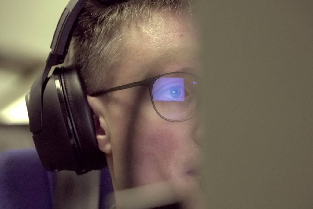 A crew member analyzes data on a monitor aboard a French military AWACS surveillance plane as it flies a 10-hour mission Tuesday, Jan. 9, 2024, to eastern Romania for the NATO military alliance.