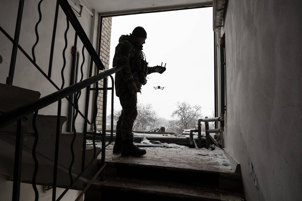 A drone operator with the Ukrainian Army's 93rd Brigade launches a DJI Mavic 3 drone near the front line with Russian troops on Feb. 18, 2023, in Bakhmut.