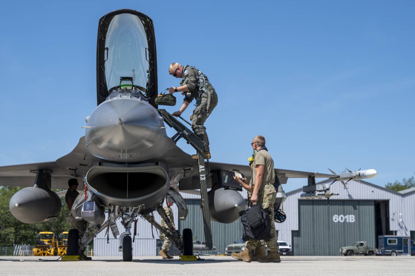 Ohio Air National Guard Capt. Travis Dancer exits his aircraft after landing at Alpena Combat Readiness Training Center in Michigan during the Global Information Dominance Experiment 3 in July 2021.