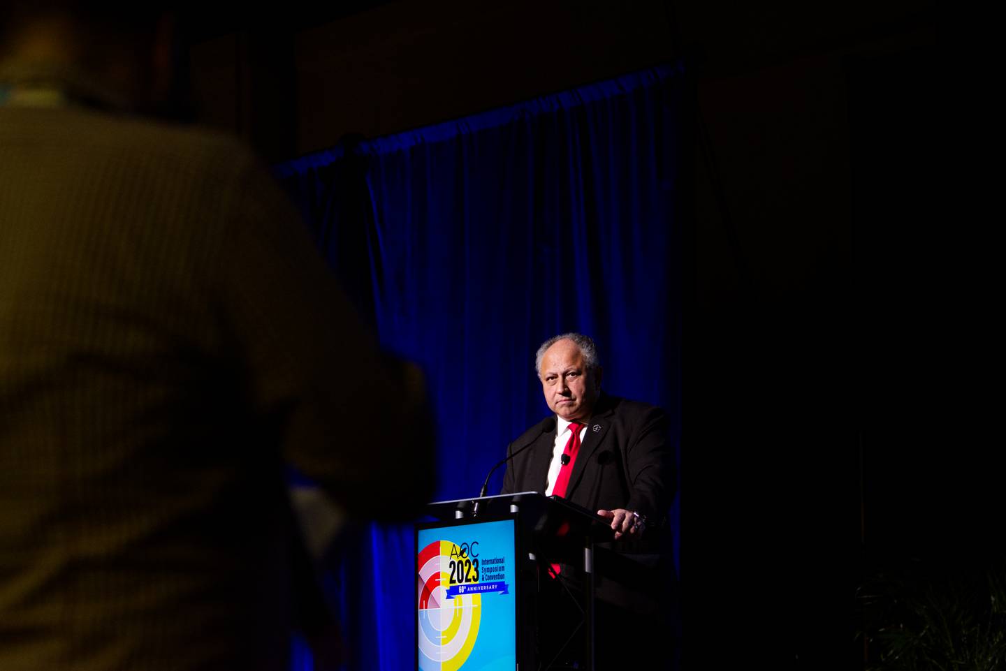 U.S. Navy Secretary Carlos Del Toro listens to a question from the audience Dec. 12, 2023, at the Association of Old Crows conference in National Harbor, Maryland.