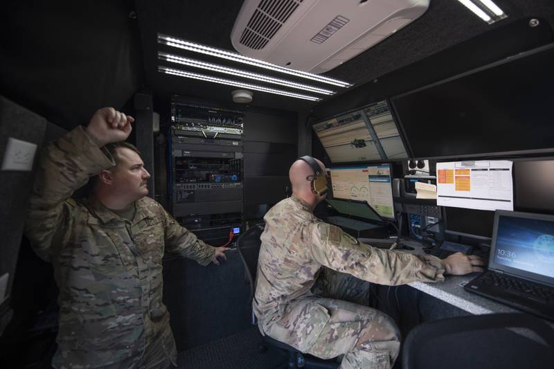 Master Sgt. Kyle Pearson and Tech. Sgt. Kevin Koenig are pictured at a simulated austere base during an Advanced Battle Management System exercise on Nellis Air Force Base, Nevada, in September 2020.